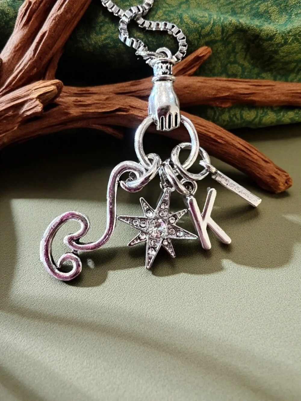 Monk DND necklace with the wind, a star, and KI Dungeons and Dragons jewelry